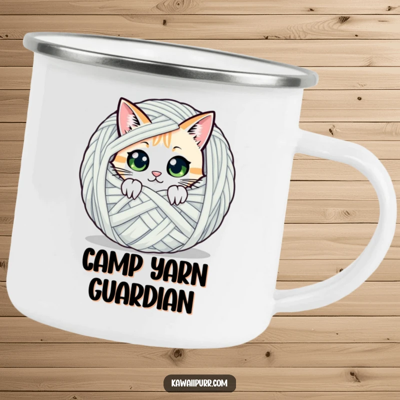 Funny enamel camping mug showing a cat character peeking from behind yarn, perfect for outdoor cat enthusiasts.