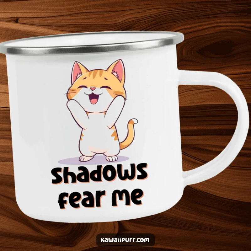Funny Cat Camping Mug: A sturdy enamel mug showing a cat gleefully pouncing on its shadow during an outdoor adventure.