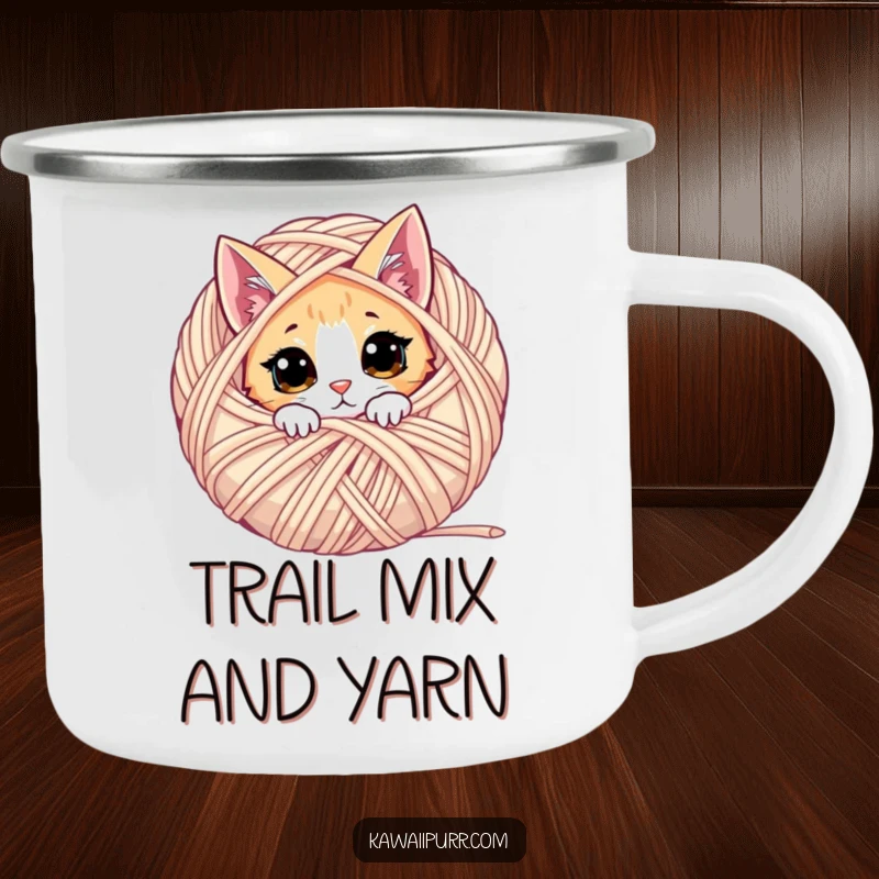 Funny enamel camping mug with a curious cat peeking from behind yarn, perfect for outdoor use.