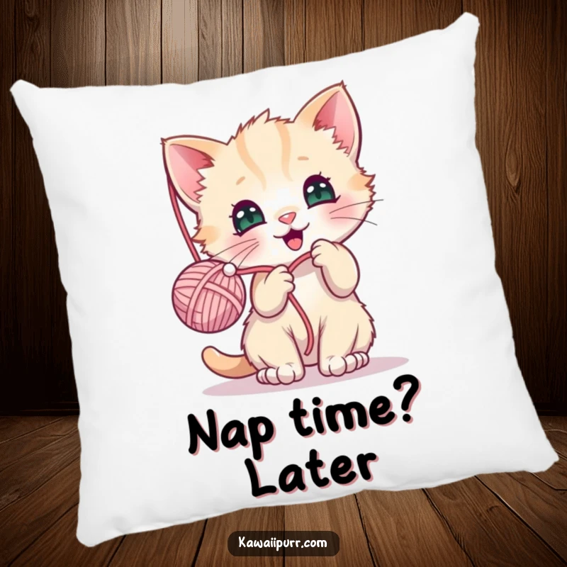 Funny pillow featuring a kawaii kitten engrossed in batting a dangling yarn ball, adding a cute and humorous touch.