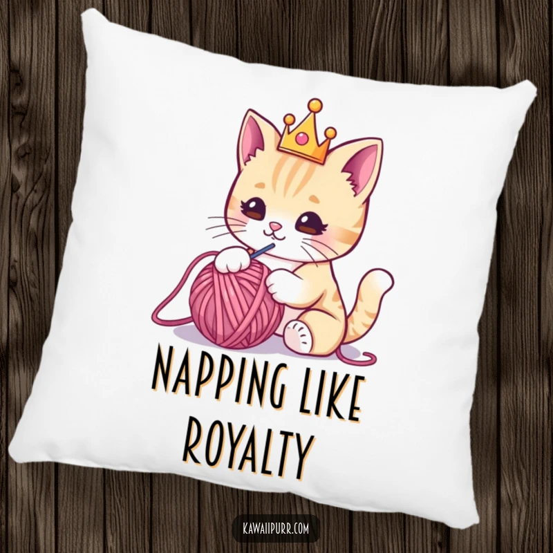 Funny pillow featuring a kawaii cat in a small crown, playfully batting at a yarn ball, combining plush comfort with feline humor.