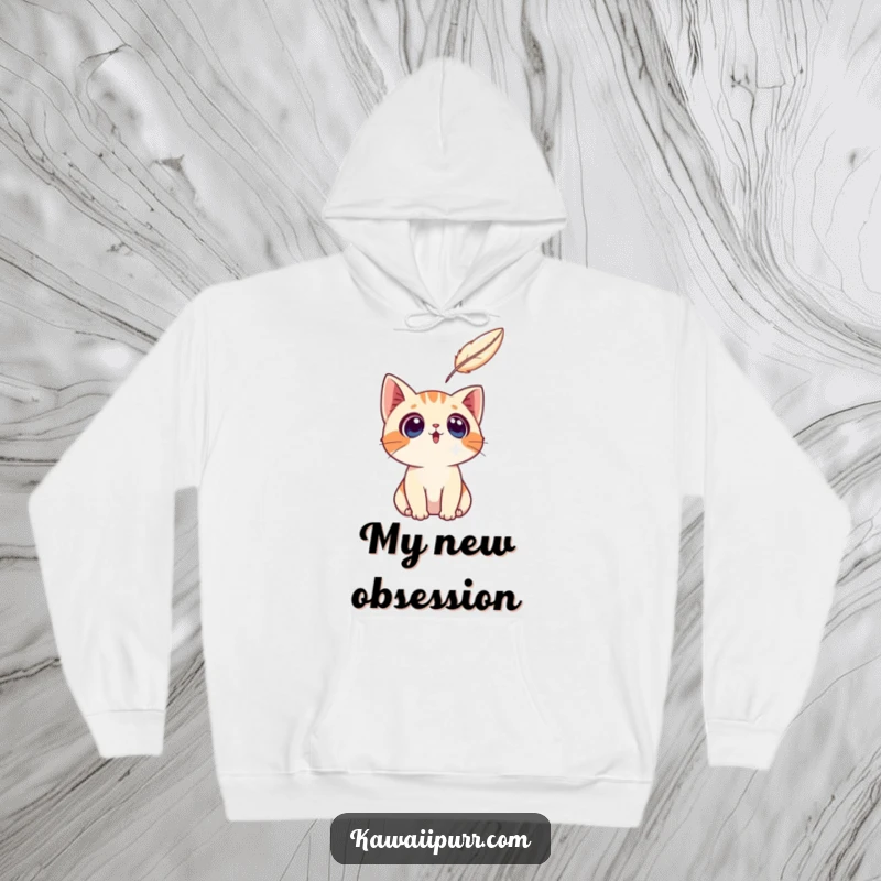 Funny surprised cat character staring with fascination at a floating feather, featured on a warm hoodie.