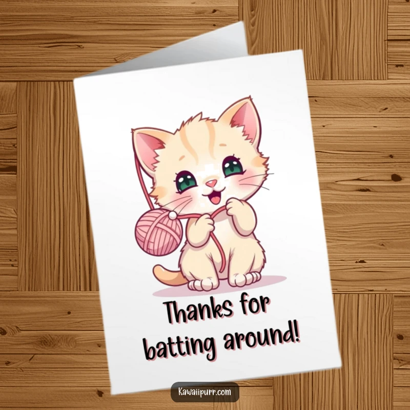 Funny Free Printable Thank You Card: Kawaii kitten character joyfully batting at a dangling yarn ball, conveying thanks playfully.