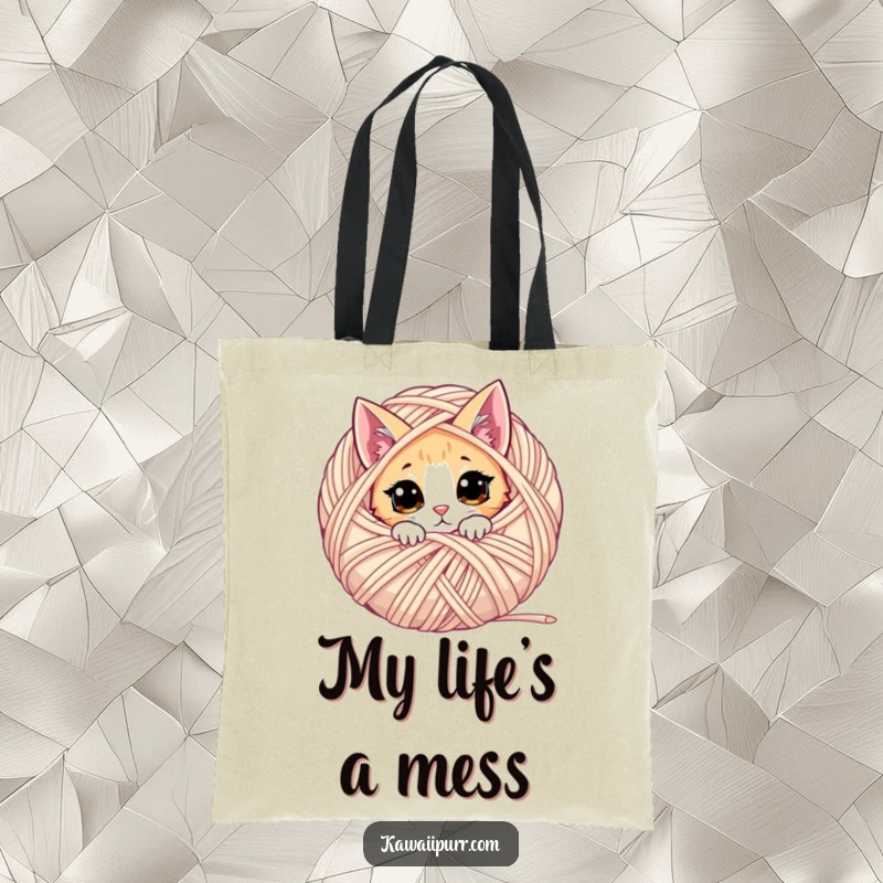 Funny cat tote bag with a curious cat peeking from behind a giant yarn ball, great for crafters.